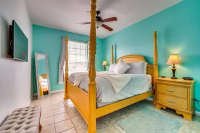 a bedroom with a bed and a ceiling fan at 6 Mi to Disney Kissimmee Resort Vacation Rental! in Kissimmee