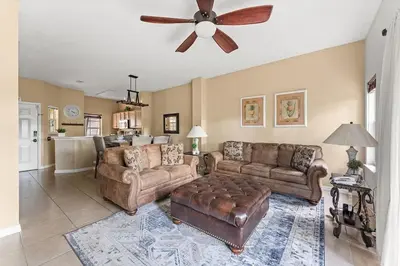 a living room with couches and a ceiling fan at Harry Potter Themed 3 BR - ER2782 in Kissimmee