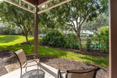 a porch with two chairs and a gazebo at Harry Potter Themed 3 BR - ER2782 in Kissimmee