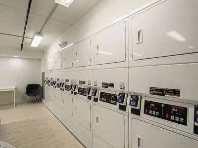 a room with a row of machines in a laboratory at Luxury Orlando 1BR Condo with Pool view & Next to Disney in Kissimmee