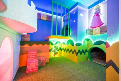 a room with a play room with a princess on the wall at Sea World neighbor Deluxe Home Up to 33 ppl 5800 in Orlando