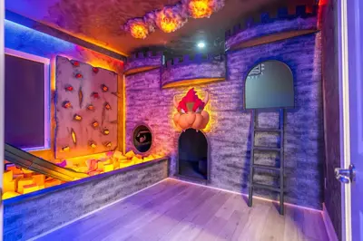 a castle themed room with a climbing wall at Sea World neighbor Deluxe Home Up to 33 ppl 5800 in Orlando