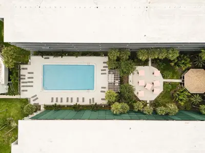 an overhead view of a building with a swimming pool at Orlando 1BR Condo with lake view & minutes to Disney in Kissimmee