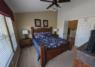 a bedroom with a bed and a ceiling fan at Beautiful 3 bed townhome in Windsor Hills Resort townhouse in Orlando