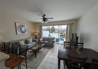 a living room with a couch and a table at Beautiful 3 bed townhome in Windsor Hills Resort townhouse in Orlando