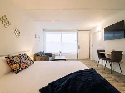 a bedroom with a bed and a desk and a window at Central Orlando 1BR Retreat & minutes to Disney Parks in Kissimmee
