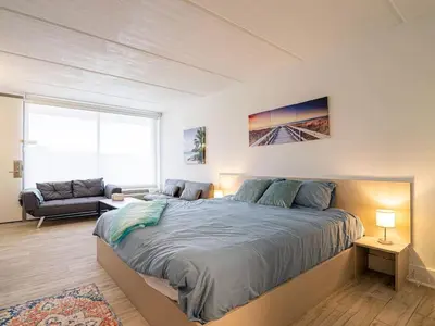 a bedroom with a large bed and a couch at Orlando 1BR comfort With Lake view minutes to Disney Parks in Kissimmee