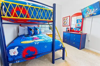 a childs bedroom with a bunk bed and a dresser at 2304 Silver Palms #205 in Kissimmee