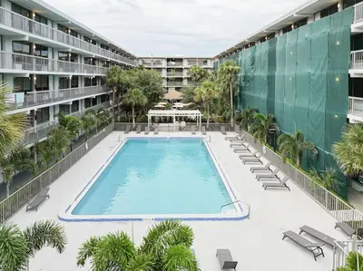 an empty swimming pool in the middle of a building at Orlando Paradise 1BR With view & minutes to Disney in Kissimmee