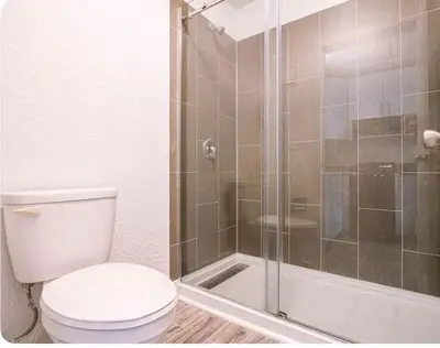a bathroom with a toilet and a shower at Peaceful Haven 1BR Next to Disney Parks in Orlando in Kissimmee