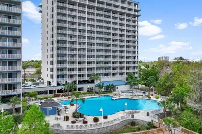an aerial view of a large apartment building with a swimming pool at Cozy Lakeview Condo near Disney in Orlando