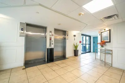 an empty hallway with a elevator in a building at Beautiful Zen Nest 1mile New EPIC Universe in Orlando