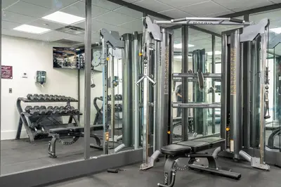 a gym with rows of treadmills and machines at Beautiful Zen Nest 1mile New EPIC Universe in Orlando