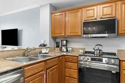 a kitchen with a sink and a stove at 5-Min to Disney Lakeside Retreat in Orlando