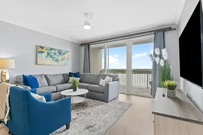 a living room with a couch and a tv at 5-Min to Disney Lakeside Retreat in Orlando