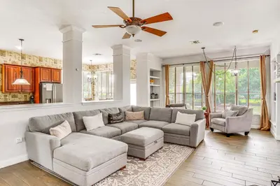 a living room with a couch and a ceiling fan at Community Amenities at Spacious Orlando Home! in Orlando