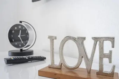a clock sitting on a table next to the word mom at A Magical condo close to Disney CSS1 in Kissimmee
