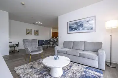 a living room with a couch and a table at A Magical condo close to Disney CSS1 in Kissimmee