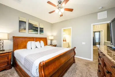 a bedroom with a bed and a ceiling fan at New And Gorgeous Townhome, Vista Cay - 4008 in Orlando
