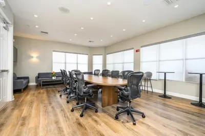 a conference room with a wooden table and chairs at New And Gorgeous Townhome, Vista Cay - 4008 in Orlando