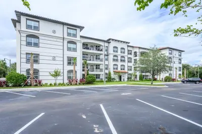 an empty parking lot in front of a building at Brand New Modern Vista Cay Reserve Condo - 5003 in Orlando