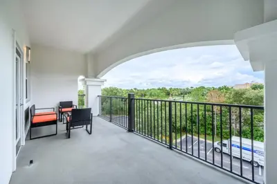a balcony with a view of a street at Epic Universe Modern Vista Cay Condo - 5005 in Orlando