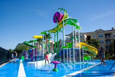 a pool with a water park with a water slide at 2533 Renshaw Street in Orlando