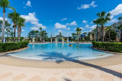 a swimming pool at a resort with palm trees at 2533 Renshaw Street in Orlando