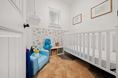 a childs room with a blue chair with stuffed animals at 3148 Caribbean Soul Drive in Orlando
