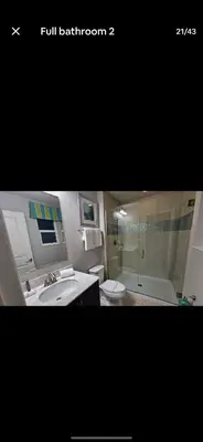 a bathroom with a sink and a shower and a toilet at Pool Private tub BBQ Mins to Disney and Universal in Kissimmee