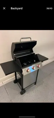 a barbecue grill sitting on top of a table at Pool Private tub BBQ Mins to Disney and Universal in Kissimmee