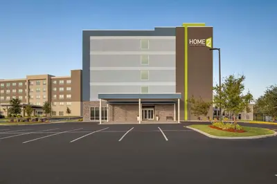a rendering of the front of a hotel parking lot at Home2 Suites By Hilton Sanford Orlando North in Sanford