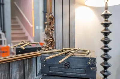 a suitcase sitting on a table in front of a mirror at A Galaxy’s Edge Experience Awaits 5 Min to Disney in Orlando