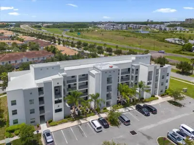 an aerial view of a large white building at 2 Bedrooms 2 Bathrooms Storey Lake Ct in Kissimmee