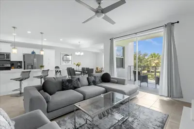 a living room with a couch and a table at 2 Bedrooms 2 Bathrooms Storey Lake Ct in Kissimmee