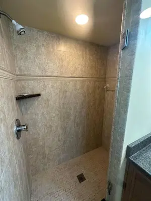 a bathroom with a shower with a glass door at 3 Bed 2 Bath amazing Lakeview , Jacuzzi Bath Tub in Oviedo