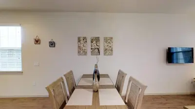 a dining room with a table and chairs at Quiet 2 Bed Cottage in Oviedo w Resort Discounts in Oviedo