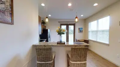 a kitchen with a island with chairs and a counter top at Quiet 2 Bed Cottage in Oviedo w Resort Discounts in Oviedo