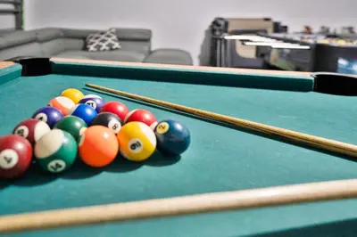 a group of billiard balls on a pool table at Stunning Home Near Disney World in Orlando
