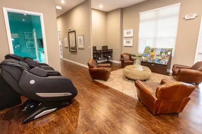 a salon with leather chairs and a waiting room at Elegant, Spacious 3bedroom Near Attractions Hot Tub Pool & Gym in Kissimmee