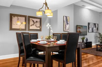 a dining room with a table and chairs at Enchanted 4BR Family Style Townhome in Disney Area in Orlando