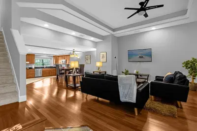 a living room with couches and a dining room at Vibrant 4BR Family Townhome 1 mile from Disney World and Disney Springs in Orlando