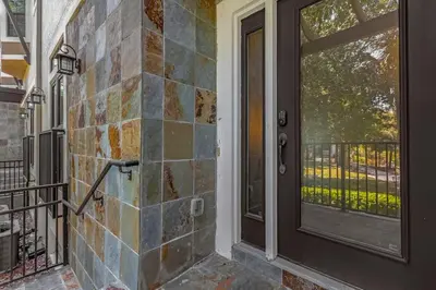 a front door of a house with a window at Vibrant 4BR Family Townhome 1 mile from Disney World and Disney Springs in Orlando