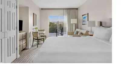 a hotel room with a large bed and a desk at Marriott Grande Vista Luxury Studio in Orlando