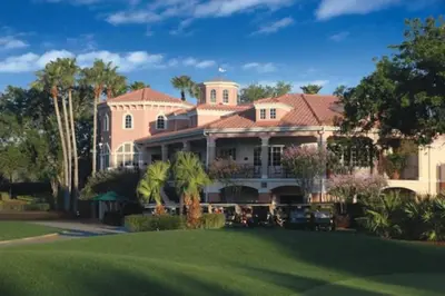 a large pink house with a green yard at Marriott Grande Vista Luxury Studio in Orlando