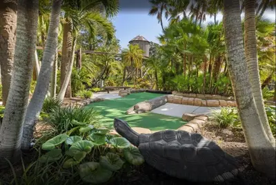 a garden with a turtle in the middle of a yard at Have fun in this 2BD condo in a resort setting with close access to Orlando parks in Orlando