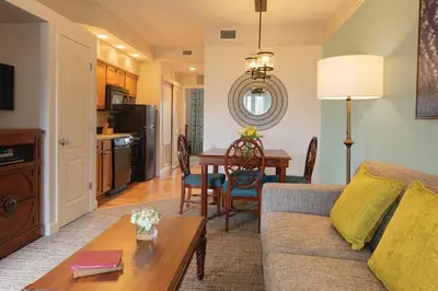 a living room with a couch and a table at Relax after enjoying all the parks Orlando has to offer in this 1BD vacation condo in Orlando