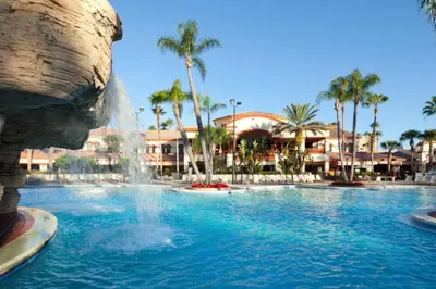 a swimming pool with a fountain in a resort at Relax after enjoying all the parks Orlando has to offer in this 1BD vacation condo in Orlando