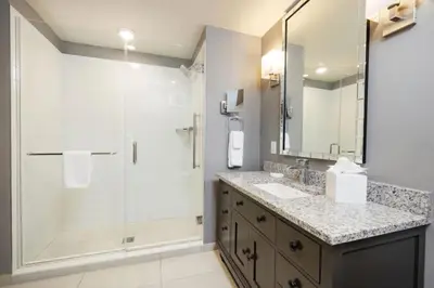 a bathroom with a shower and a sink at WorldMark Kingstown Reef - 1BD Sleeps up to 4 in Orlando