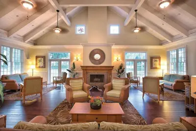 a living room with couches and a fireplace at WorldMark Kingstown Reef - 1BD Sleeps up to 4 in Orlando